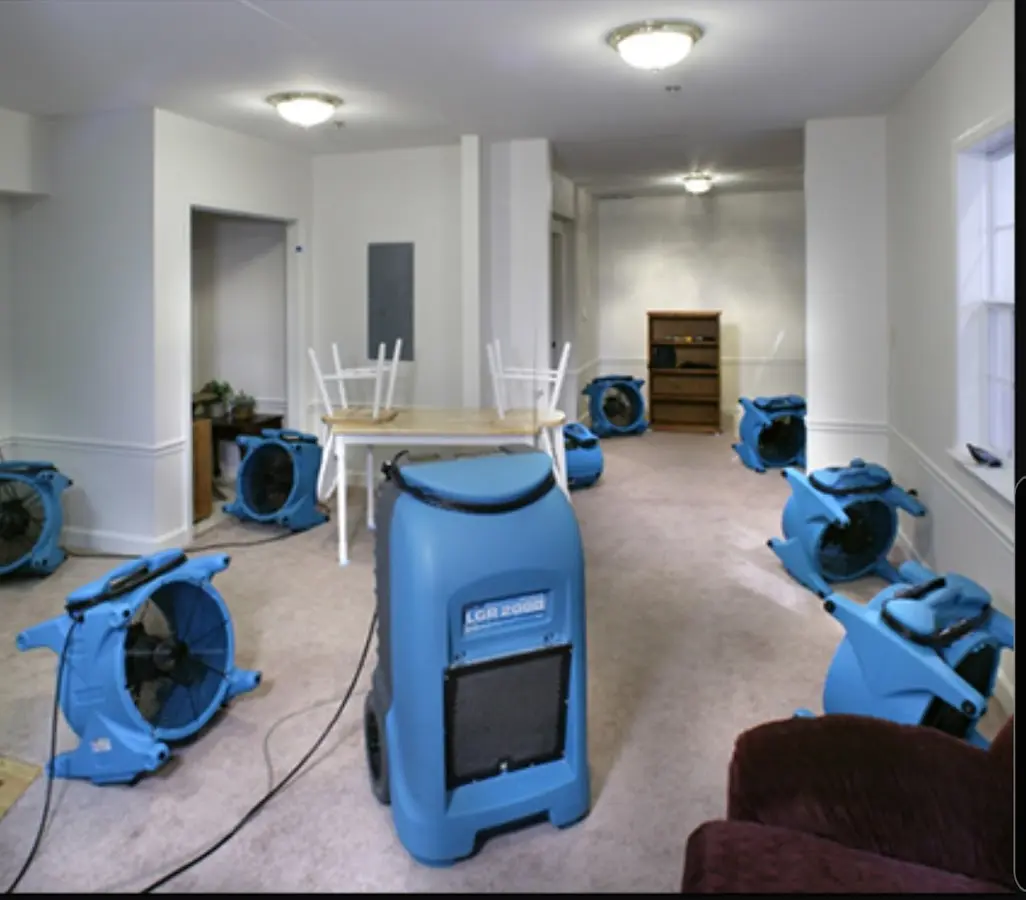 Air movers and dehumidifier setup for Water Damage Restoration in Hanson